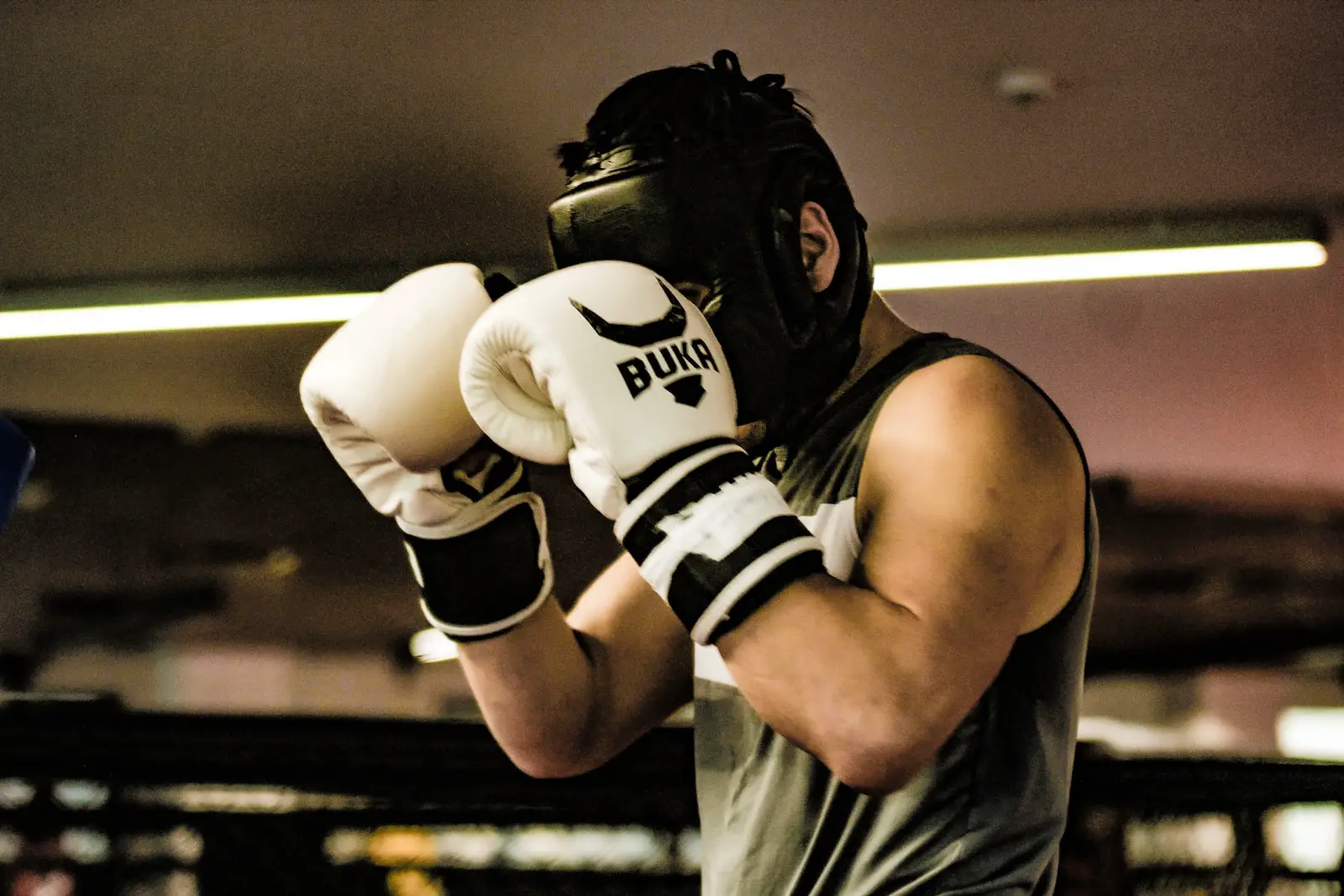 a man wearing a white and black boxing glove