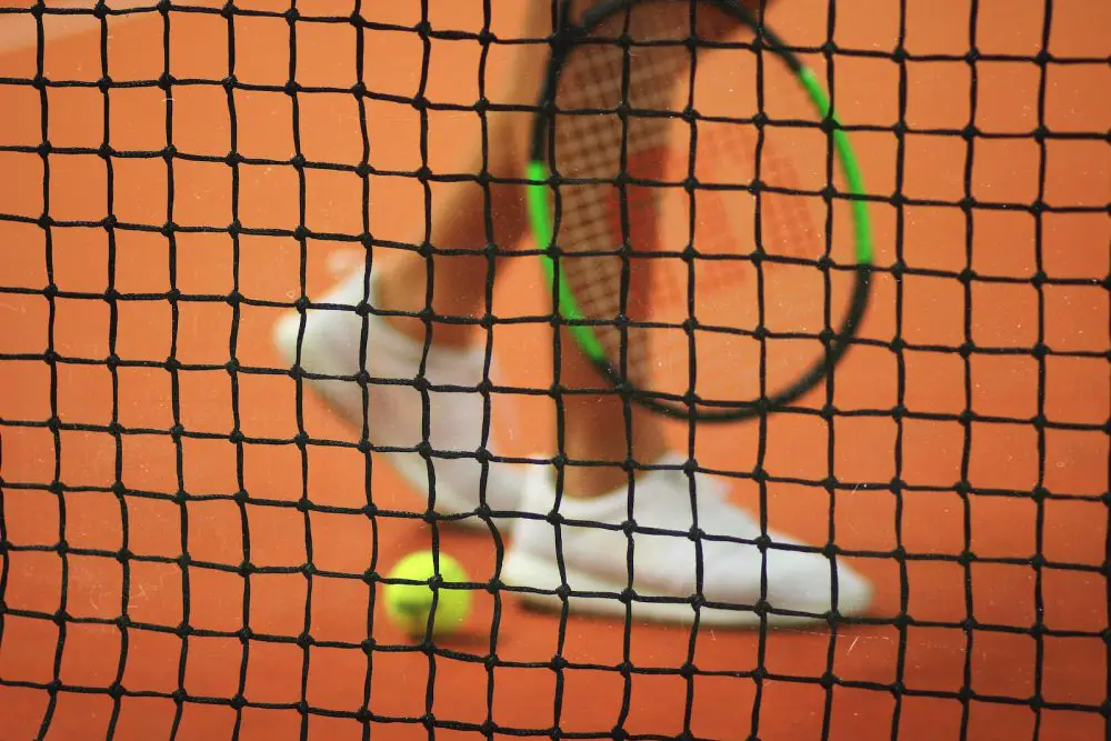 Why Is The Tennis Net Lower In The Middle? Explained By An Expert