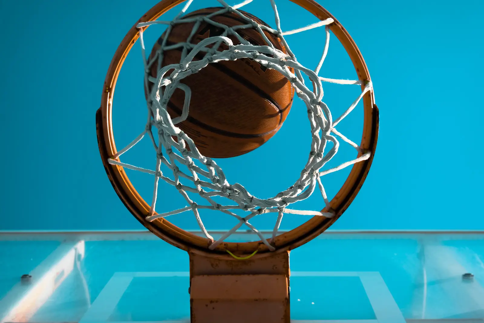 brown basketball near basketball ring